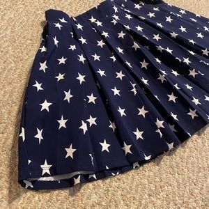 Navy blue pleated skirt with white stars